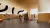 This image shows one of the play areas on the ground floor, with a play structure in the middle, and toys and children surrounding it and playing. There is also wooden beams on the ceiling, mimicking the café and the media centre, and the walls have wooden panelling up to 1.1 metres. 