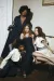 Four models posed together on an antique couch, wearing garments made form denim and Irish báinín wool.