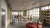 a living room filled with furniture and a large window