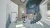 A playful sensory room on the ground floor featuring a sculptural spiral staircase, soft blue tones, terrazzo flooring, curved timber detailing, integrated seating nooks, and interactive play elements designed to encourage exploration, movement, and sensory development for children.