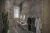 a close up of a stone building that has a sink and a mirror