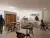 a living room filled with furniture and a table