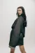 A model posing to show off sleeve details and cloak.