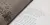 Close-up page from "Fragments: Lisbon, 1755", showing irregular serif text on cream paper beside a textured grey page of scattered letters