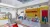 Gaming and study zone featuring “The Fuel Station,” with gaming setups, social tables,  booth seating, and a lively atmosphere designed to support both focus and social  interaction.