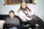 a man and a woman sitting on a couch