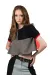  A female model with long wavy red hair wearing a black, red, and grey top with black trousers.