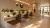 a living room filled with furniture and vase of flowers on a table