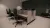 a bedroom with a bed and desk in a room