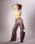 Second model wearing lilac satin trousers and a beige draped silk top against a white backdrop