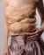 Close-up of beige draped silk corset top with measuring tape ribbon as a feature