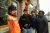 a group of people standing in front of a building