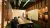 a dining room table in front of a mirror posing for the camera