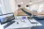 a desk with a laptop computer sitting on top of a table