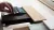 a laptop computer sitting on top of a wooden table