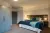 a bedroom with a bed in a room