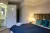 a bedroom with a bed in a room