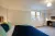 a bedroom with a bed in a room