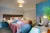 a bedroom with a bed and desk in a room