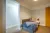 a bedroom with a bed in a room