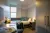 a bedroom with a bed and desk in a room