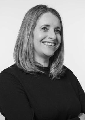 a woman who is smiling and looking at the camera