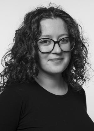 a person in glasses looking at the camera