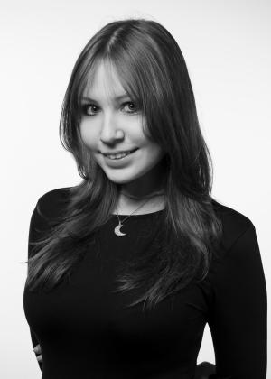 a woman who is smiling and looking at the camera