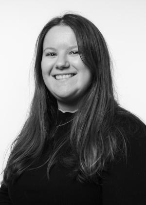 a woman who is smiling and looking at the camera