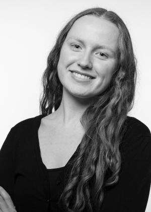a person who is smiling and looking at the camera