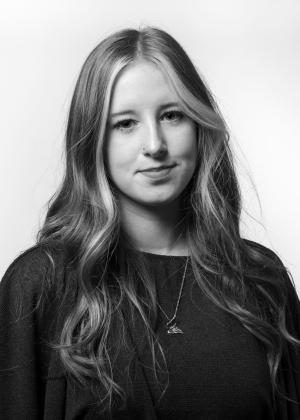 a woman who is smiling and looking at the camera