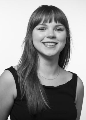 a woman smiling and posing for the camera