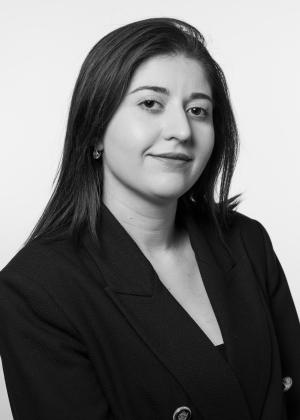 a woman wearing a suit and tie