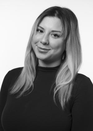 a person who is smiling and looking at the camera