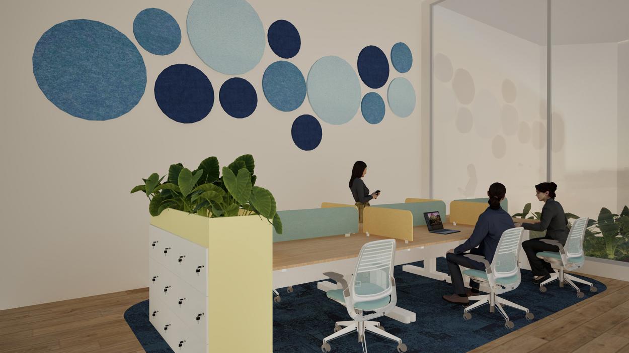 a group of people sitting at a desk