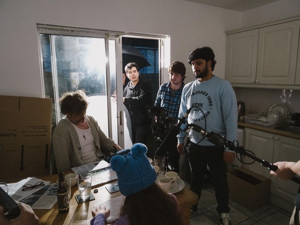 a group of people standing in a room