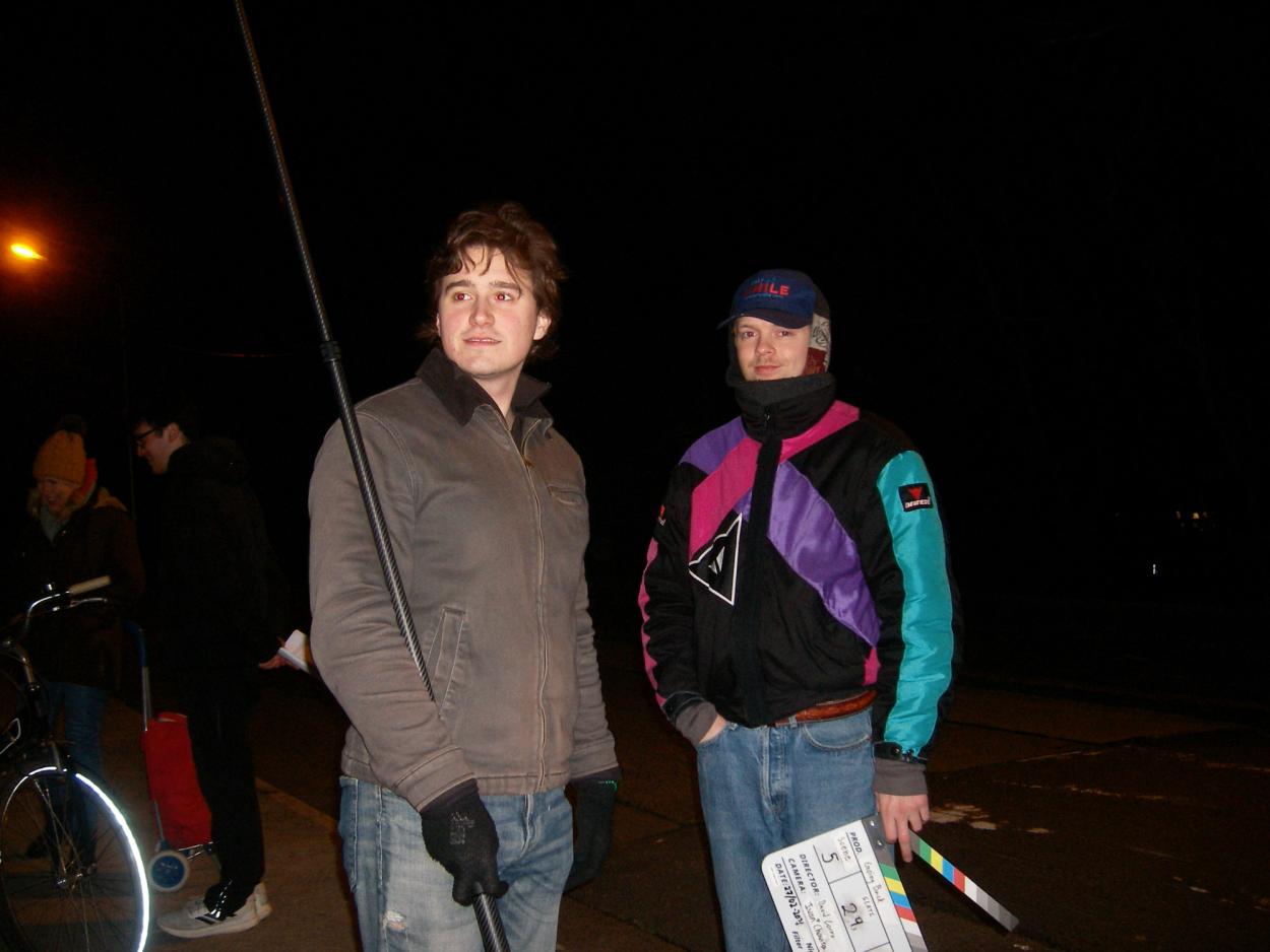 Alex and Aleksa standing on set.  