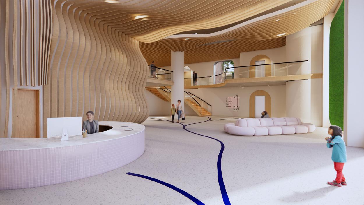 Pictured is a double-height reception space with a desk, seating area and ceiling details. There is a pathway drawn on the floor and a mezzanine level is visible in the background. 
