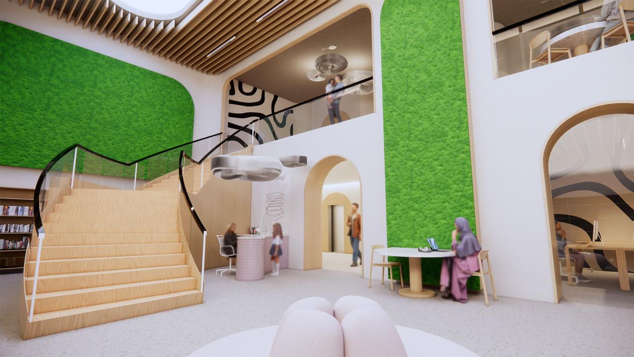 This image depicts the media centre and shows the desk, as well as some parts of the shelves, the computer room and seating areas. There are moss installations and bespoke lighting elements that mimic the café area, and the double-height space is clearly seen. 