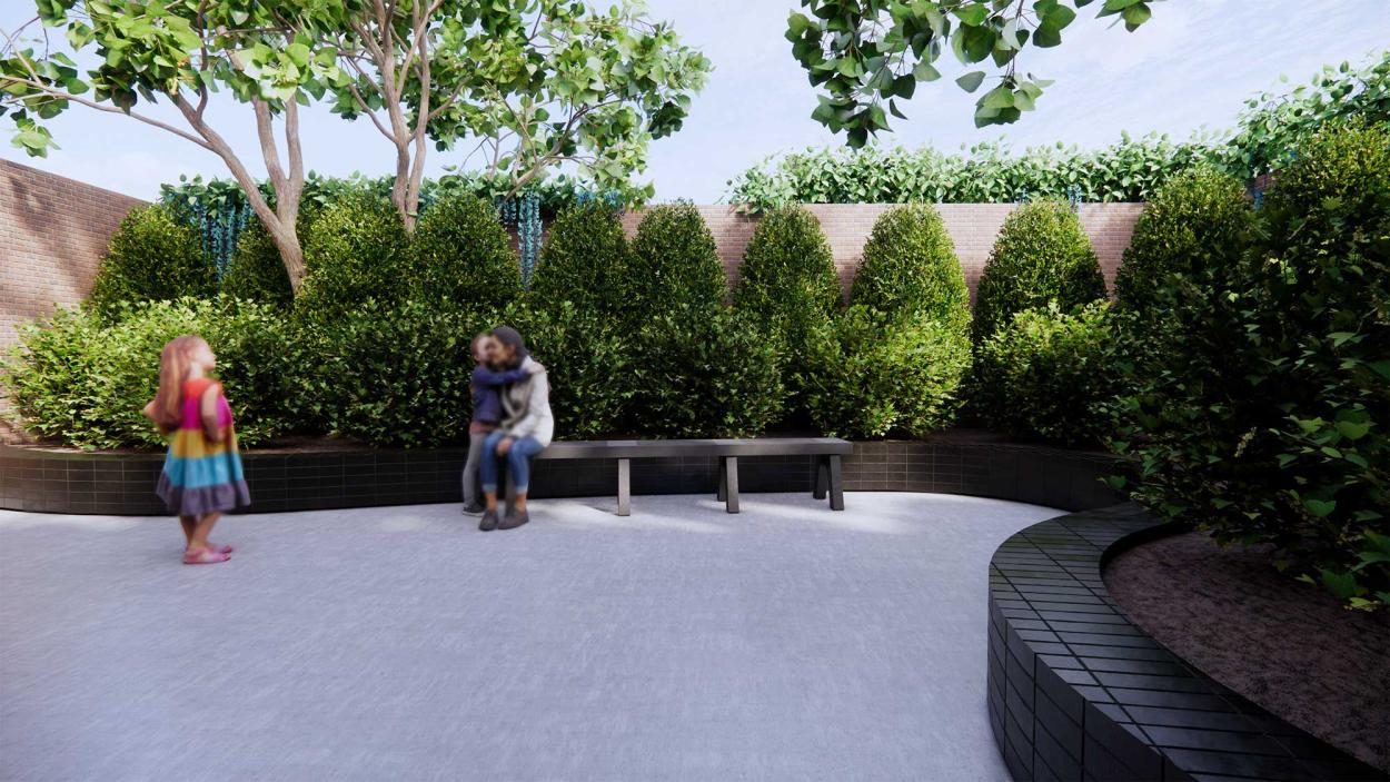 This image shows a small family spending time in a small rooftop garden, with surrounded by bushes and trees. 
