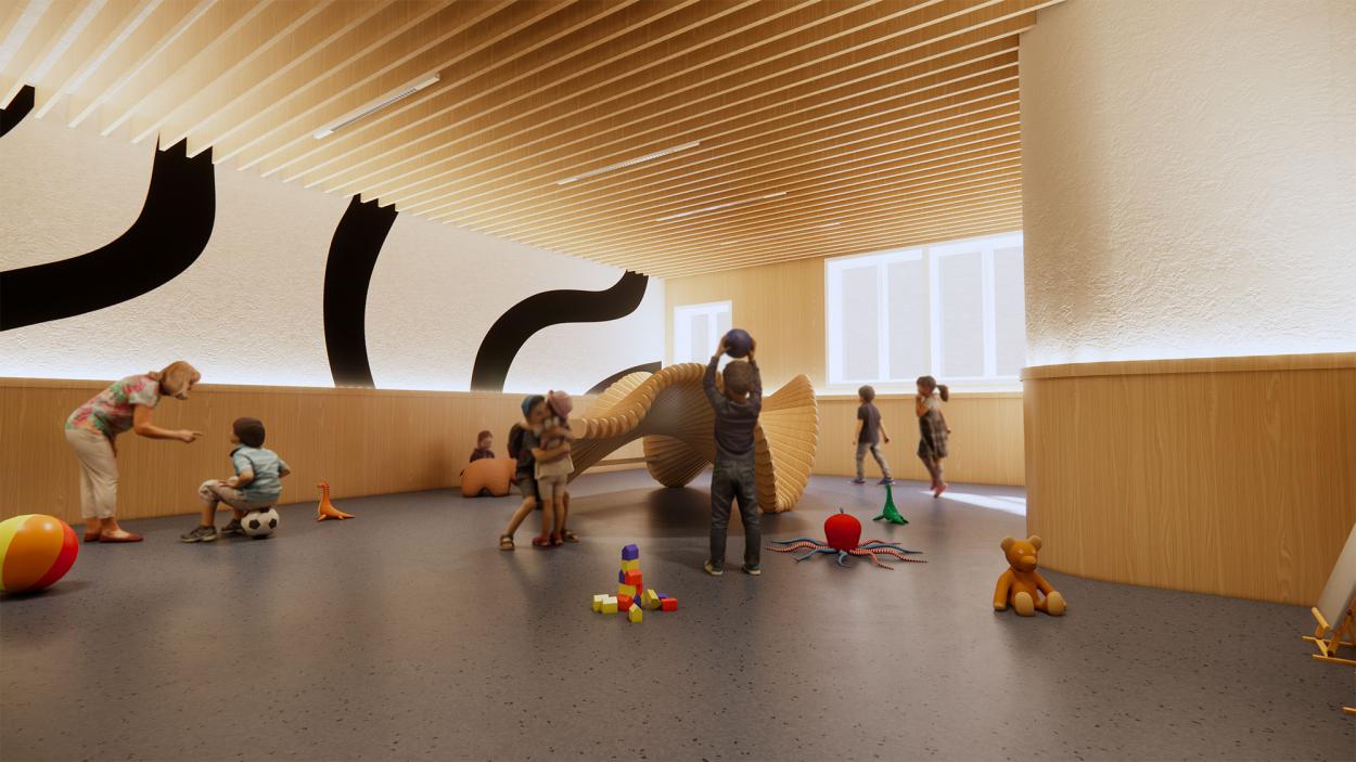 This image shows one of the play areas on the ground floor, with a play structure in the middle, and toys and children surrounding it and playing. There is also wooden beams on the ceiling, mimicking the café and the media centre, and the walls have wooden panelling up to 1.1 metres. 