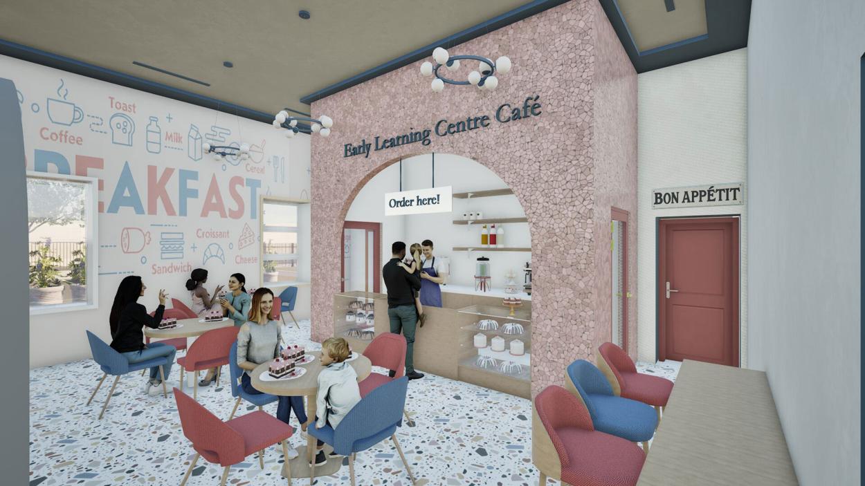 A welcoming café within the early learning center featuring a pink textured service counter, playful breakfast-themed wall graphics, terrazzo flooring, and colorful seating that creates a warm and family-friendly social space for children, parents, and staff.