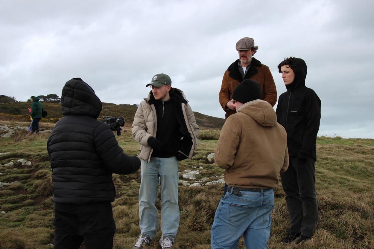 a group of people standing in a field
