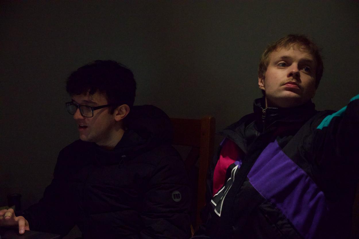 a man sitting in a dark room