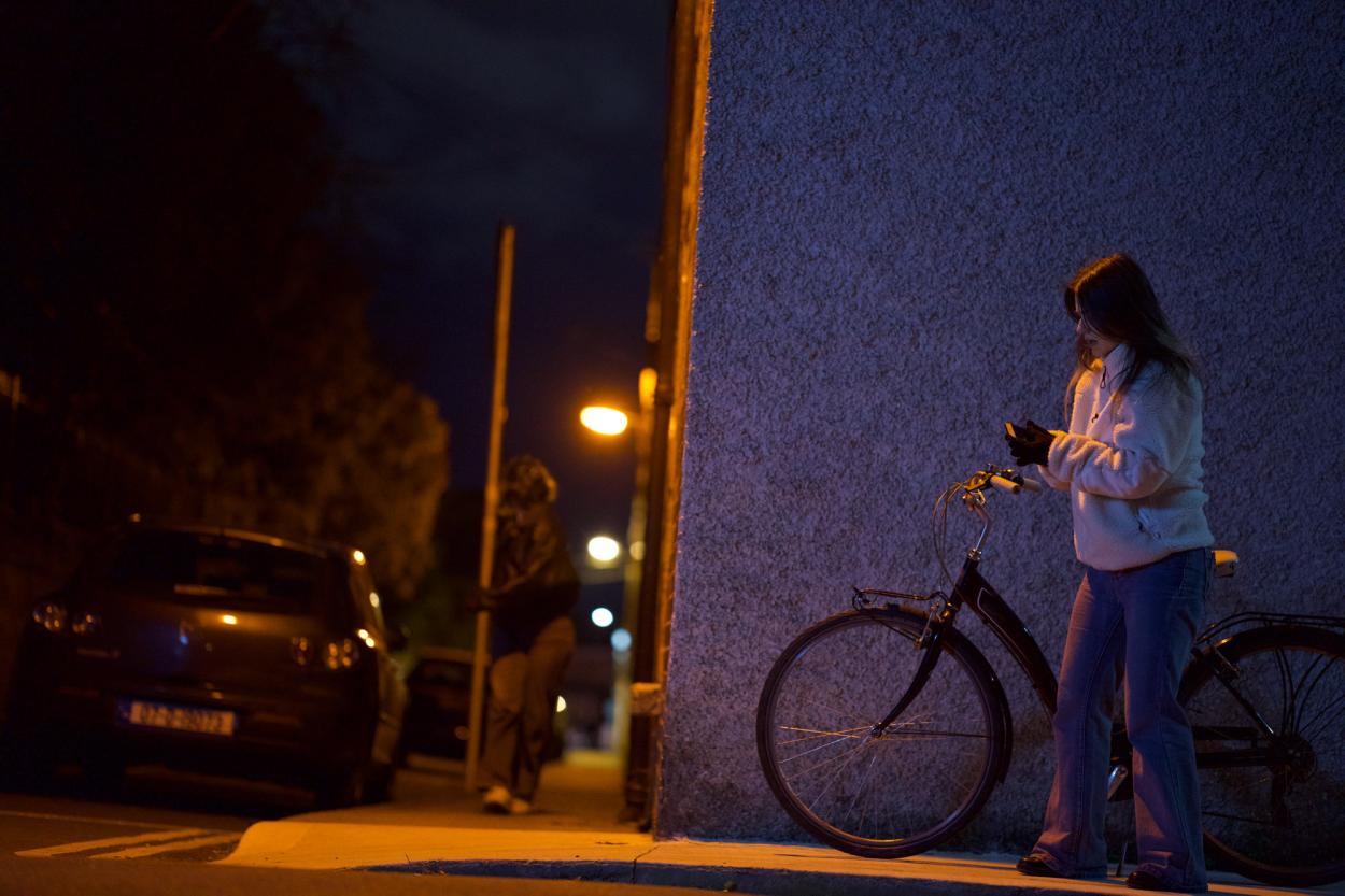 a person standing next to a bicycle