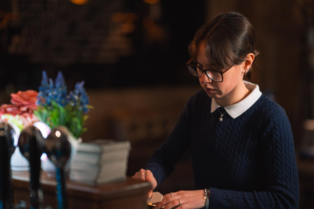 Diana Favaro dressing the set of “Only Way Out Is Through” (“Gentle Threats” chapter 2). 
