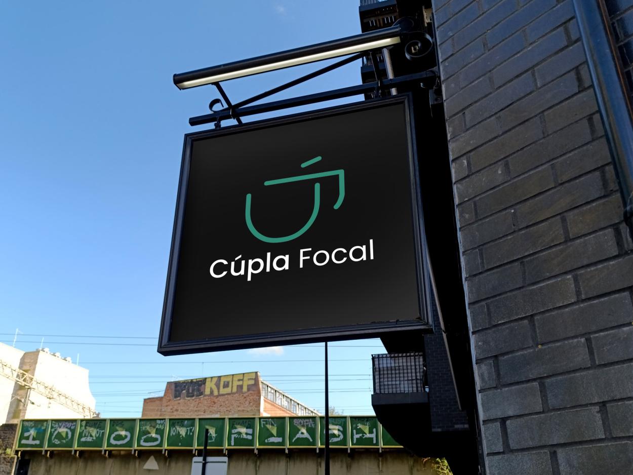 This signage mock-up demonstrates the adaptability of the brand identity with urban café settings. The contrast between the dark background and vibrant logo colours enhances visibility and reinforces the brands modern and culturally inspired aesthetic.