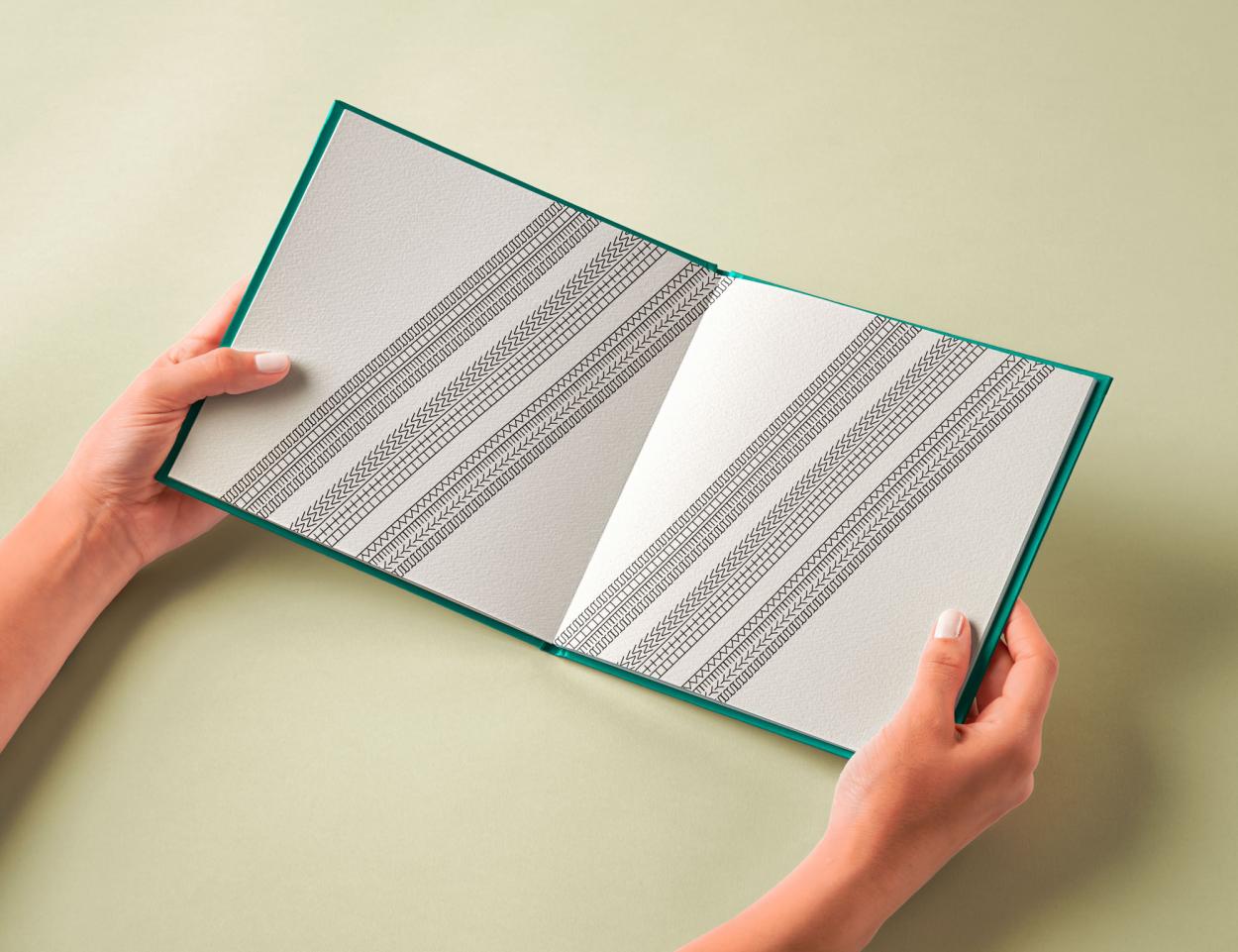 This spread from the same book, Horsepower, uses repeated tyre track patterns and directional lines to visually reference movement, speed and the physical textures associated with motorsport. Embedded within the pattern is the hidden phrase “Shes with Keys”, adding a subtle personal detail as a nod to women in motorsport.