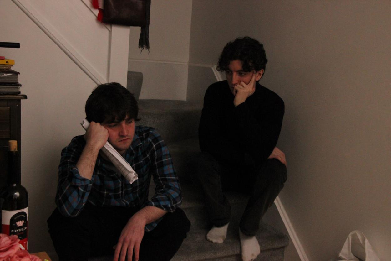 Director (James Ryan) and assistant director (Evan Colgan) contemplatin