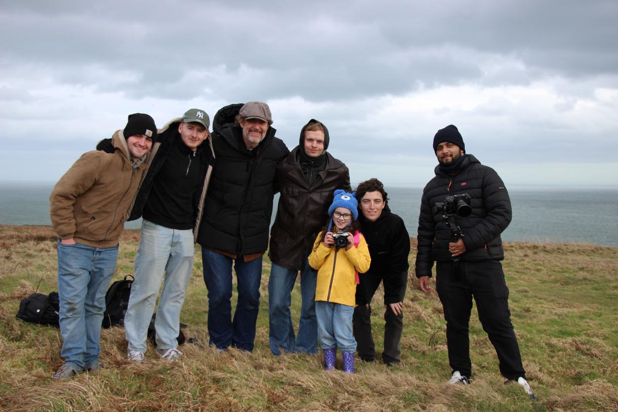 a group of people posing for the camera